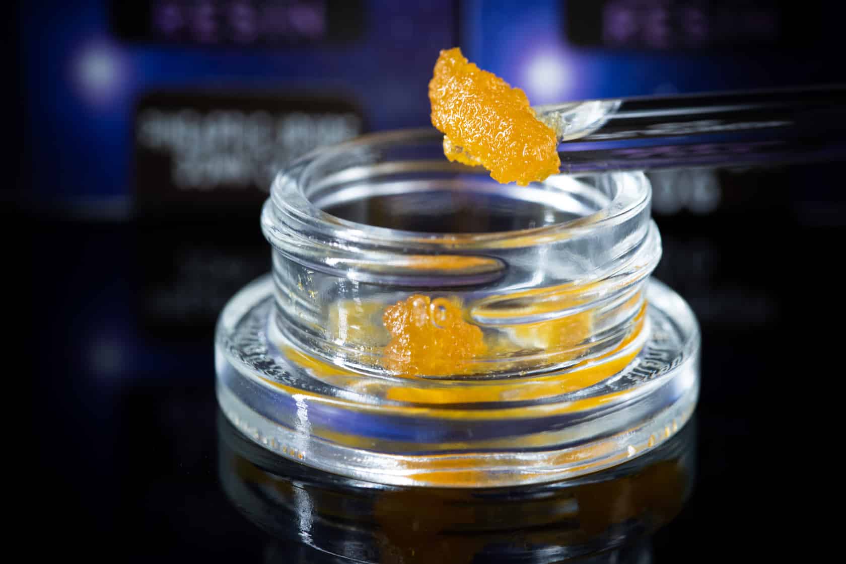 bright orange live resin extract in a glass jar